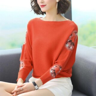 Pull motif fleuri et col bateau pour femme