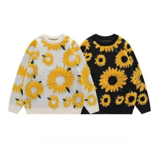 Pull noir et pull blanc avec des tournesols sur fond blanc.